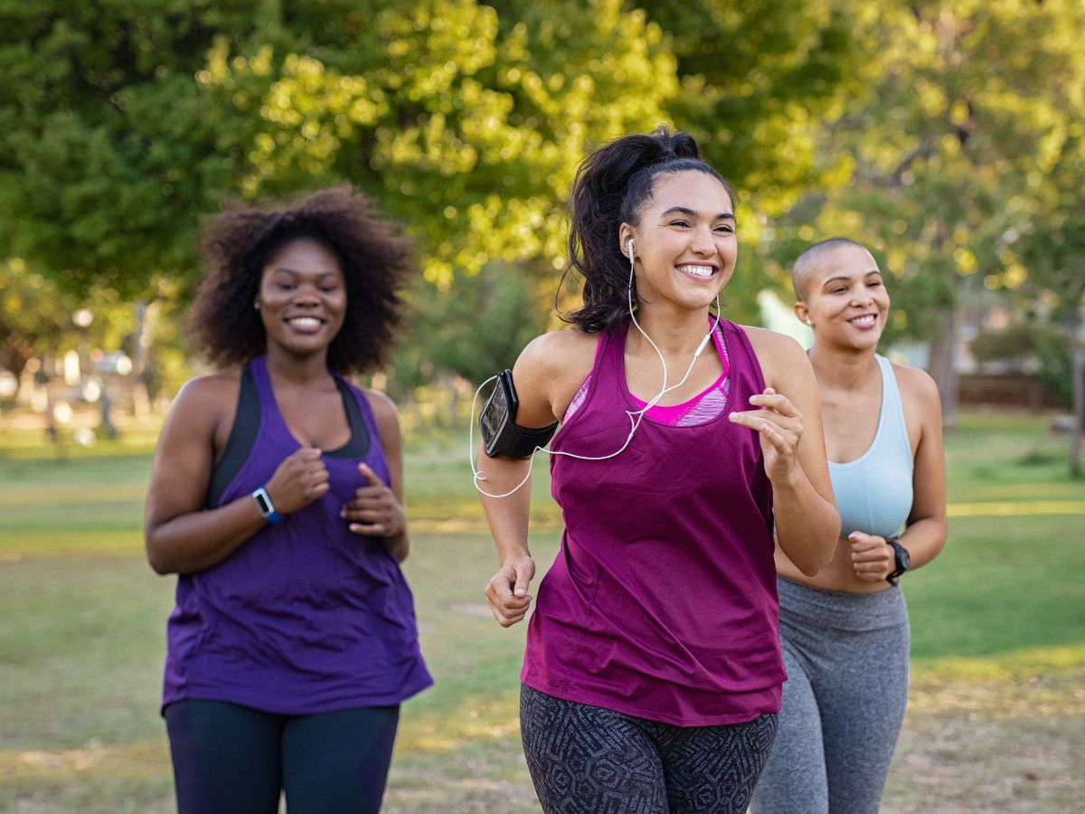 Three black women walking.